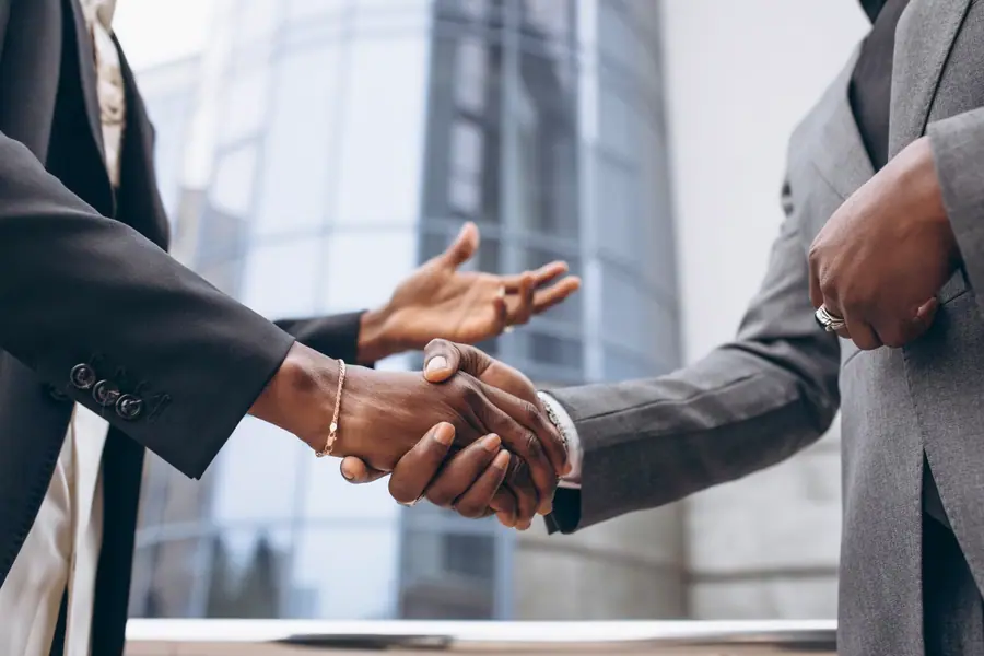 Two business people shaking hands